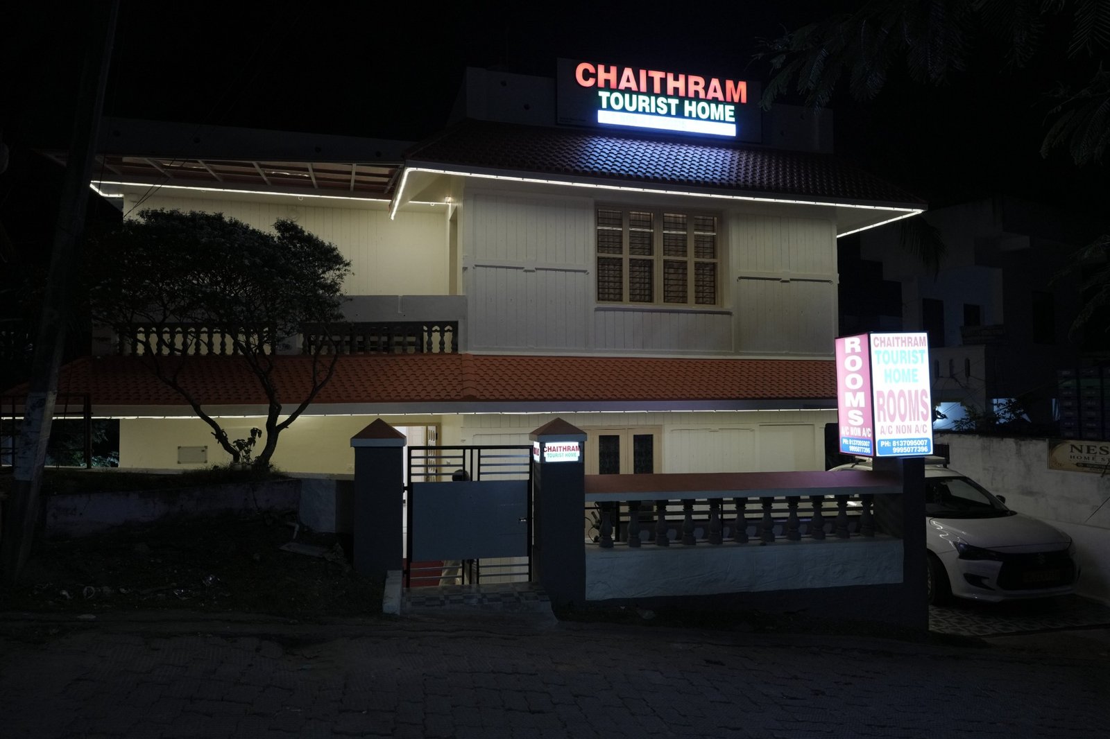 Chaithram Tourist Home exterior at night