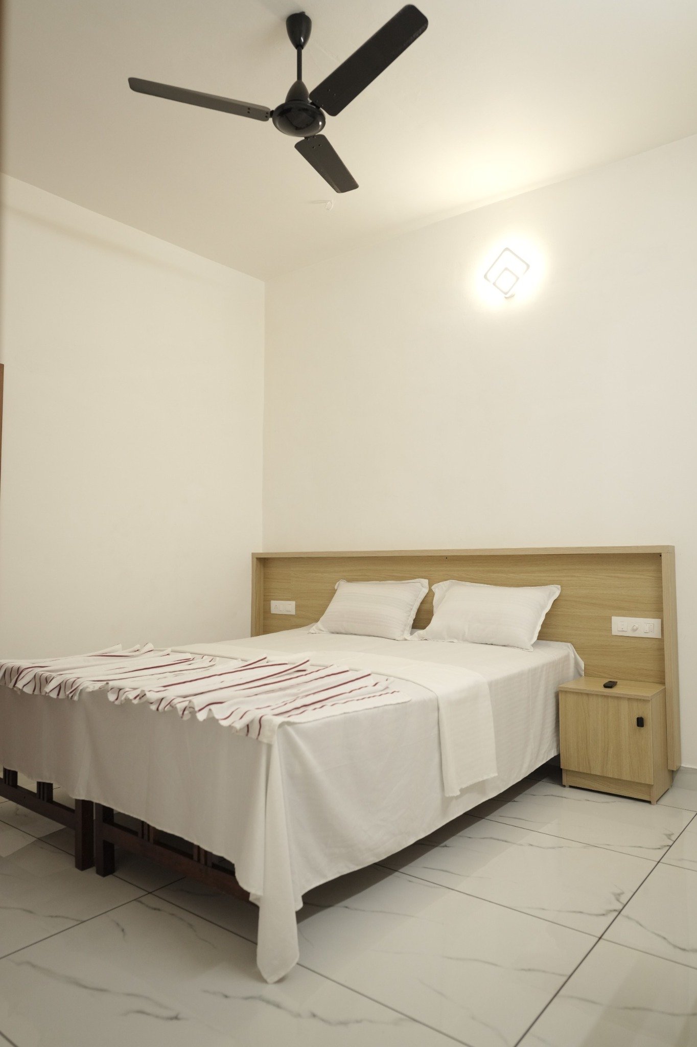 A welcoming room at Chaithram Tourist Home, Kovalam Kerala